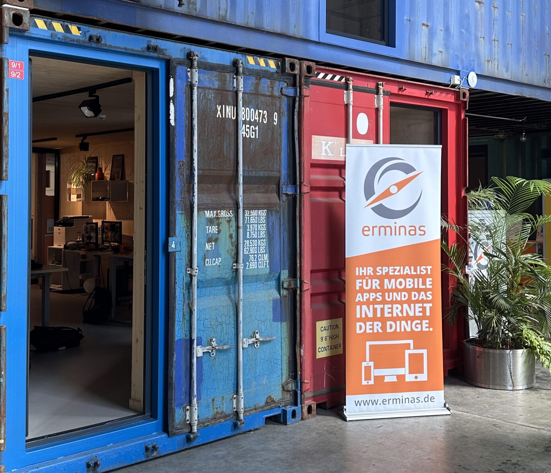 Container office entrance with ermina's display stand